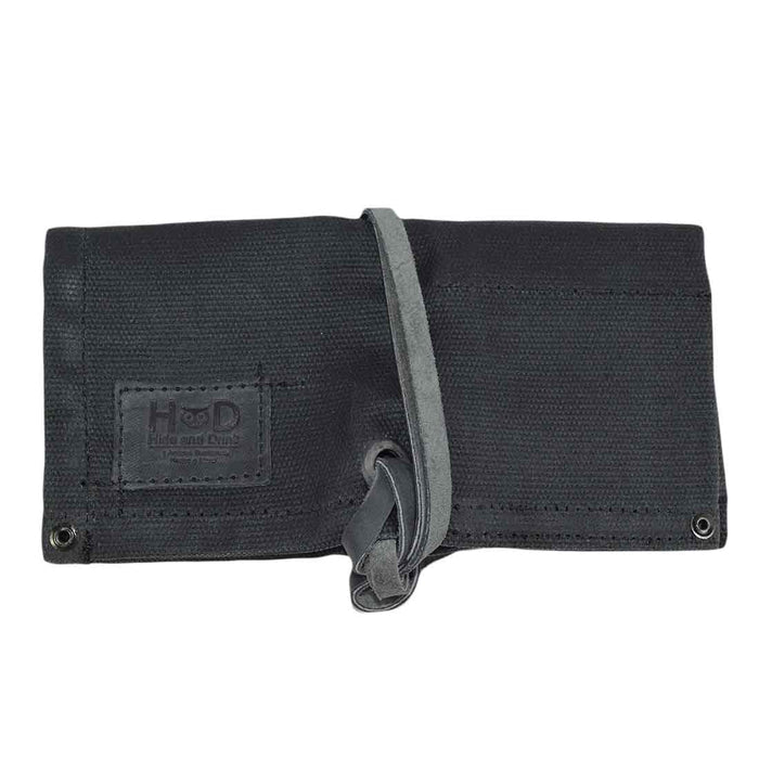 The back side of the black Waxed Canvas Watch Roll by Hide & Drink, showcasing its contemporary and practical design, perfect for watch storage.