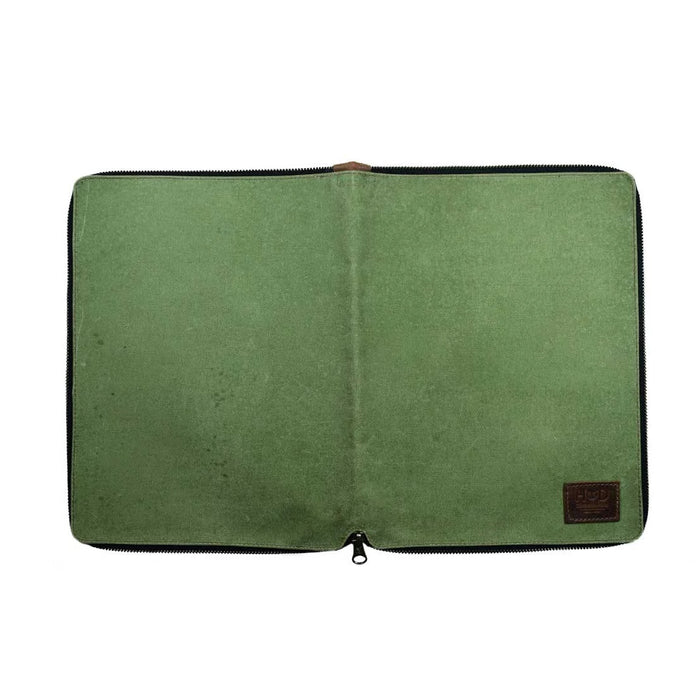 Back view of the Waxed Canvas Zippered Journal Cover for Moleskine (Notebook NOT Included) by Hide & Drink, showcasing the minimalist design in green Waxed Canvas. An ideal Cahier Case for creative minds, featuring durable Full Grain Leather, hand-cut and hand-sewn by artisans from La Antigua Guatemala & Oaxaca Mexico.