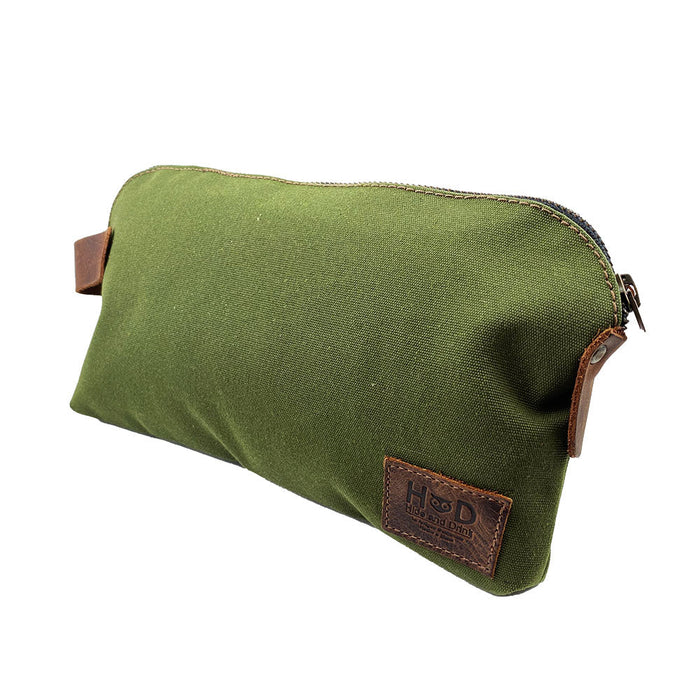Dopp Kit Utility Bag by Hide & Drink presenting a visually appealing design and robust utility. This artisan Dopp Kit Utility Bag is made from full grain leather and emphasizes the artisan techniques of hand cut and hand sewn craftsmanship in small batch production, handmade in La Antigua Guatemala & Oaxaca Mexico.
