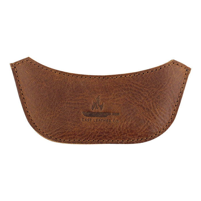 Sleek leather handle covers beautifully displayed, the Wok Sidekick from Cast Leather Co. combines functionality with rustic style. Hand sewn and fire branded, this cooking accessory is crafted from full grain leather, representing small batch production and artisan quality.