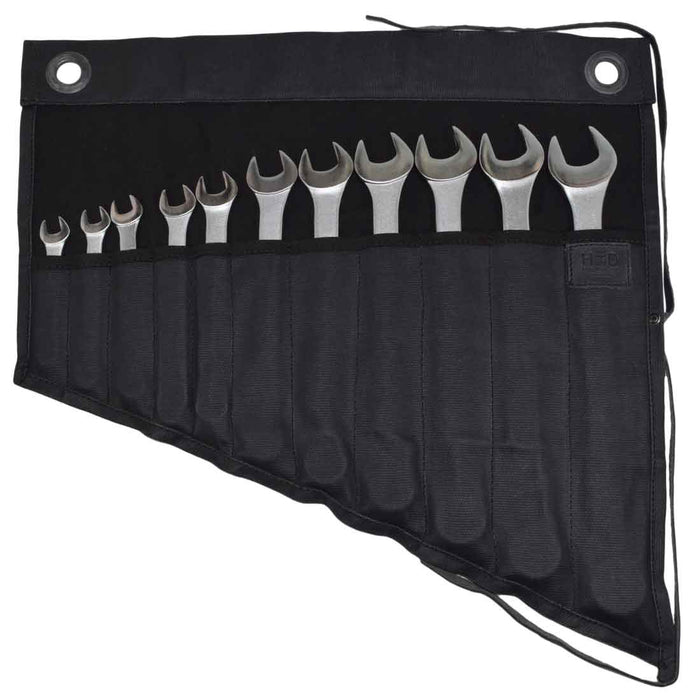 Hide & Drink's Wrench Roll (11 Pockets) displaying a collection of wrenches in a stylish black finish. This Wrench Tool Roll offers efficient hanging storage solutions for craftsmen. Crafted from durable waxed canvas, it serves as a rustic organizer, showcasing small batch production, hand cut and hand sewn features, and fire branding, artisan crafted in La Antigua Guatemala & Oaxaca Mexico.