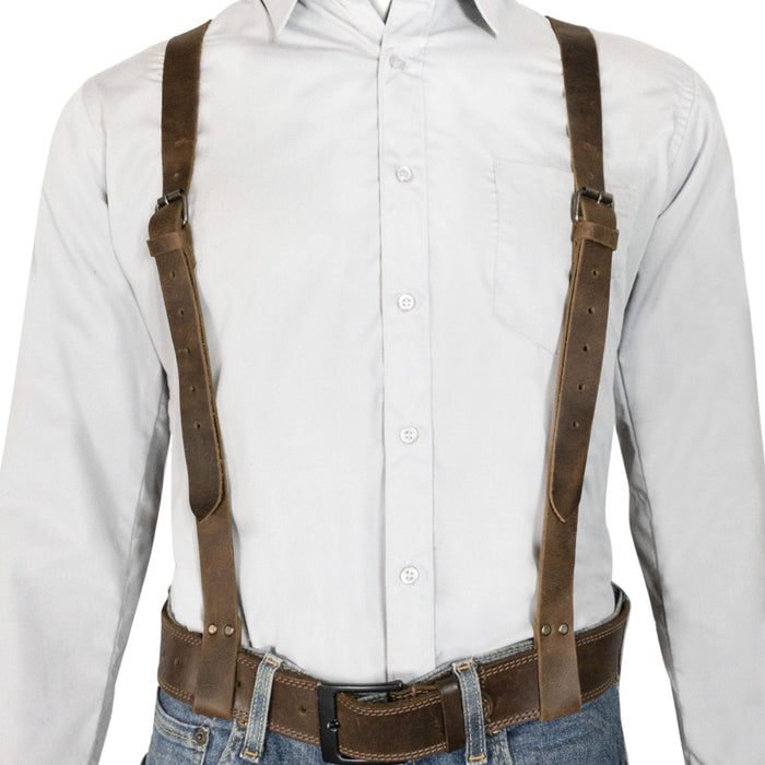 Hide & Groom's X Back Formal Suspenders with Belt Loops displayed on a model, perfect for enhancing formal attire for weddings and business meetings. Made from durable full grain leather, these adjustable suspenders are hand crafted in La Antigua Guatemala, emphasizing artisan quality and unique design.