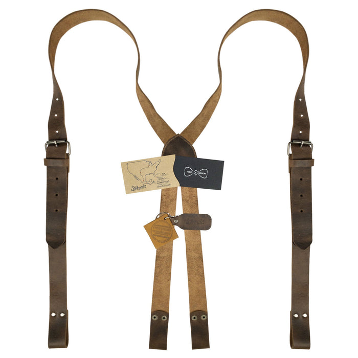 Hide & Groom's X Back Formal Suspenders with Belt Loops displayed with product tags, showcasing artisan craftsmanship and quality materials. Perfect for formal wear and groomsmen, these handmade suspenders feature adjustable straps made of full grain leather.