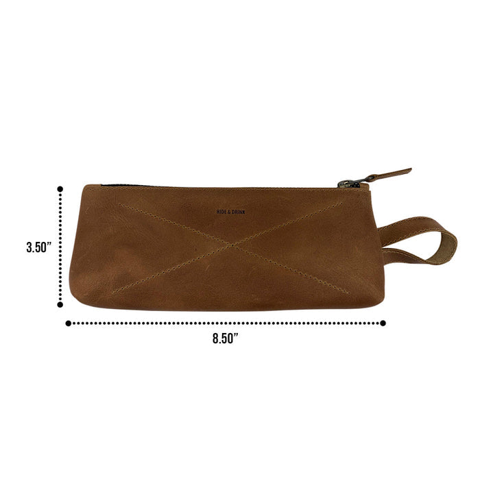 Hide & Drink's X Stitched Case, radiating artisan quality with a unique design, is perfect for organizing pens and personal items. This handcrafted full grain leather product is made in small batches in La Antigua Guatemala and Oaxaca, Mexico.