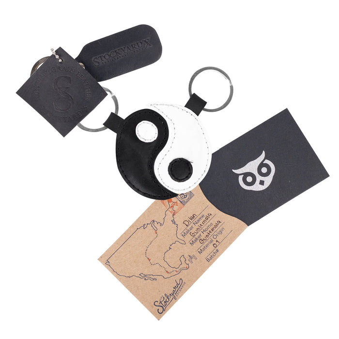 Complete set of Yin Yang Keychains (2 pieces) created by Hide & Drink, accompanied by key rings symbolizing harmony and partnership. These full grain leather accessories embrace Chinese culture and the spirit of friendship, reflecting quality through small batch production. Each piece is hand cut, hand sewn, and fire branded to guarantee excellence, an artisan creation made in La Antigua Guatemala & Oaxaca Mexico.