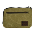 Hide & Drink's Zipper Gear Pouch made from water resistant waxed canvas, perfect for camping and travel. Features a sturdy zipper closure and artisan craftsmanship, handmade in La Antigua Guatemala.