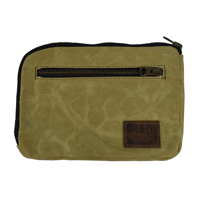Hide & Drink's Zipper Gear Pouch made from water resistant waxed canvas, perfect for camping and travel. Features a sturdy zipper closure and artisan craftsmanship, handmade in La Antigua Guatemala.