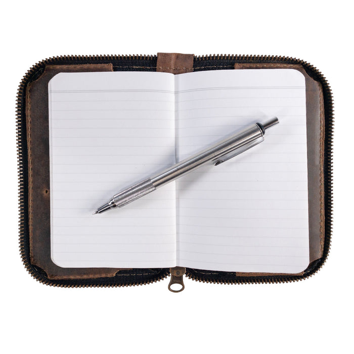 Hide & Drink's Zippered Journal Cover for Moleskine (Notebook NOT Included) with a pen placed on an open page, demonstrating its functionality. Artisan crafted from full grain leather in La Antigua Guatemala.