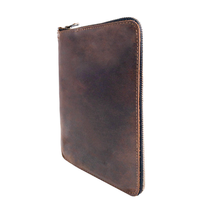 Tilted view of Hide & Drink Zippered Journal Cover for Moleskine (Notebook NOT Included), detailing its sturdy leather craftsmanship. Artisan-made in La Antigua Guatemala for functionality and style.